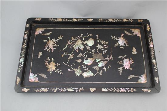 Four Chinese rosewood stands and a Chinese wood and mother of pearl inlaid tray, 19th / early 20th century, 33cm.